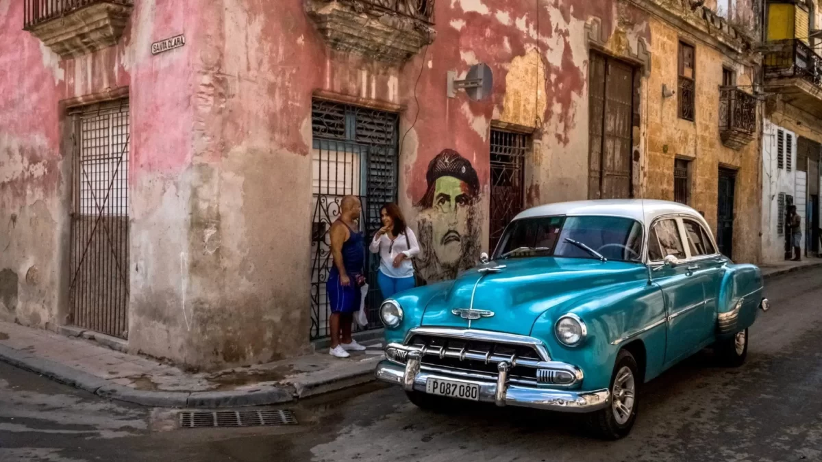 blue classic car parked on the street in Havana